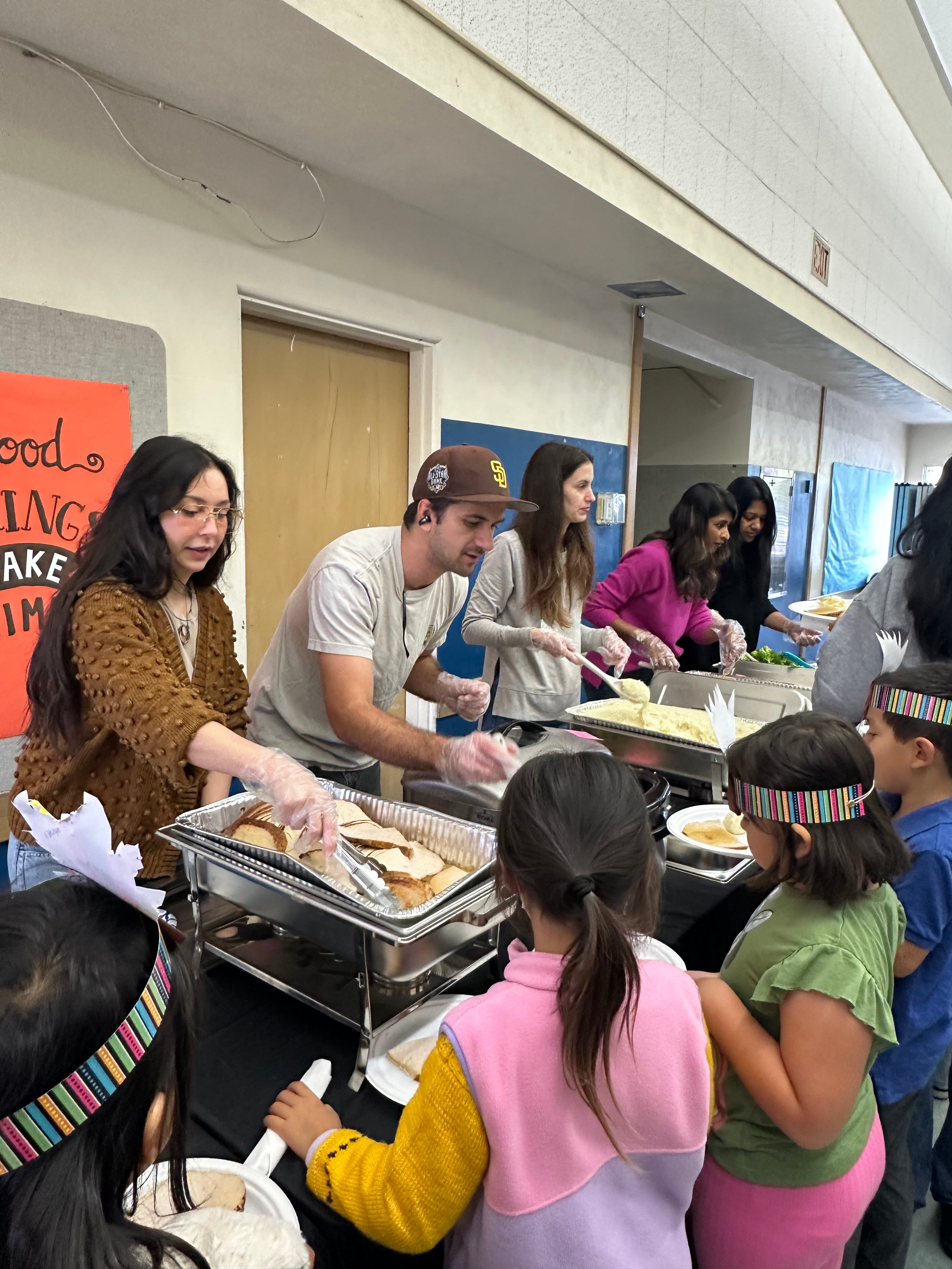 Parents Group volunteers serving students at MBMA