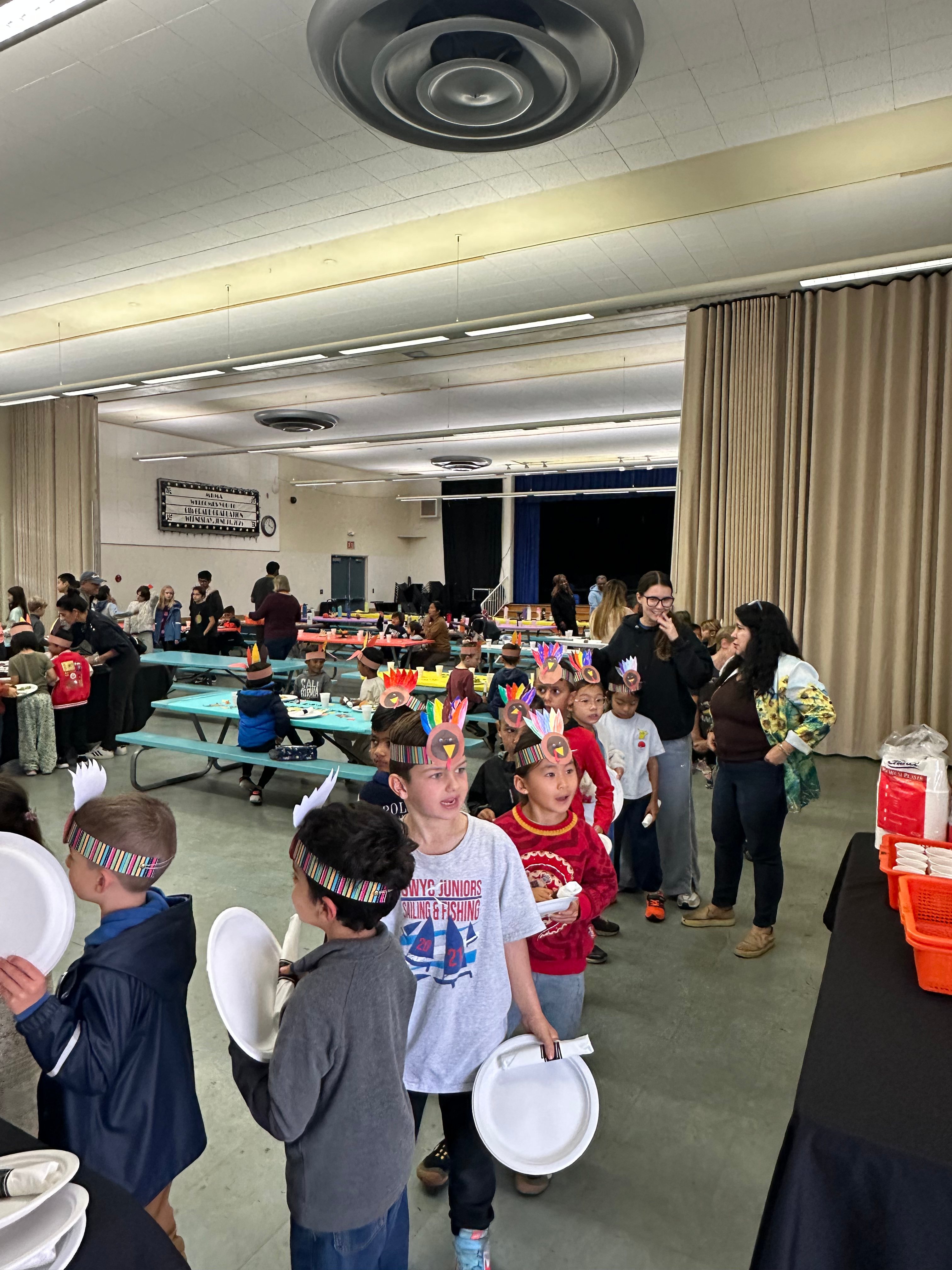 Students in line at an MBMA holiday meal