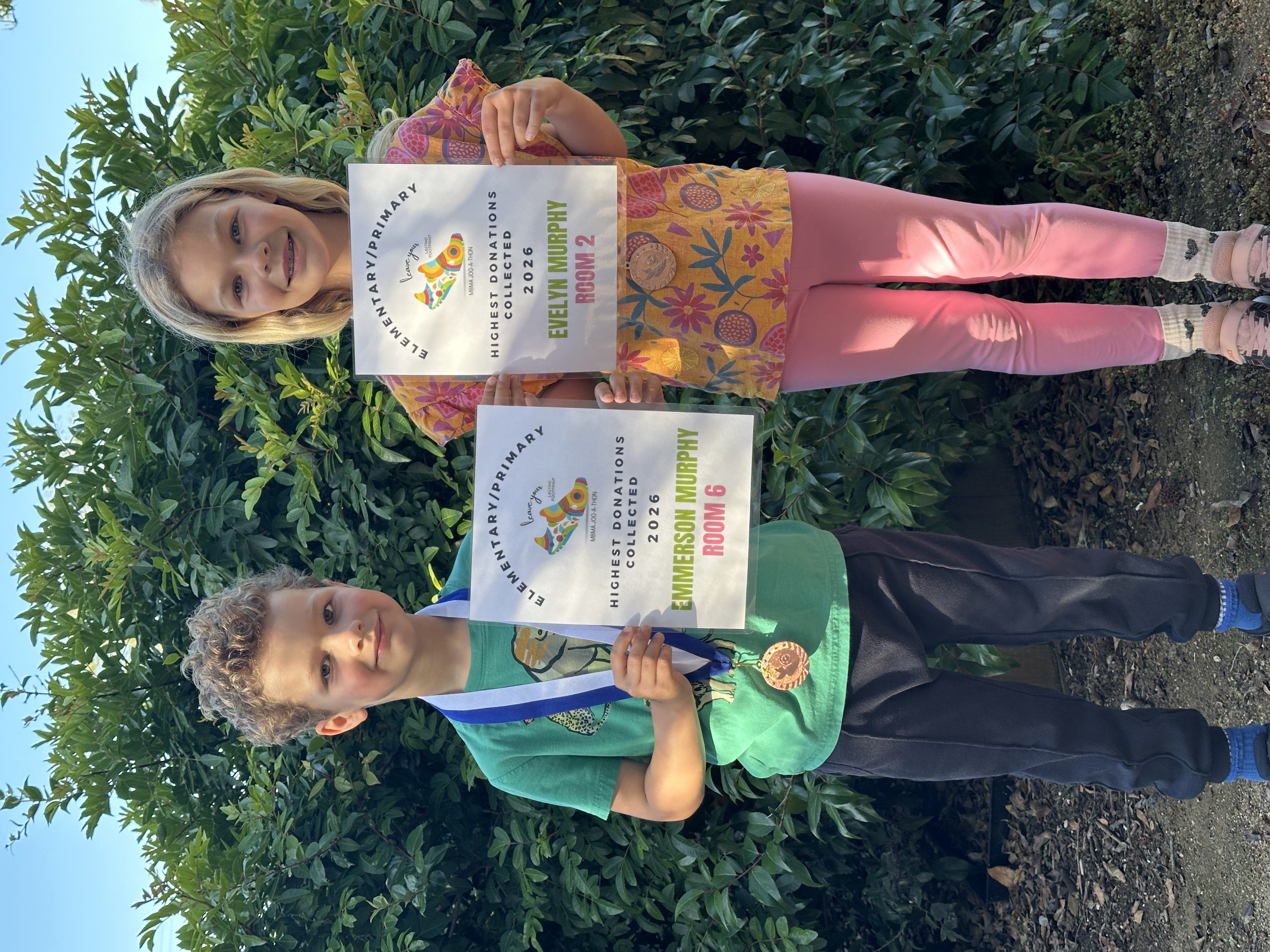Students holding Jog-A-Thon awards